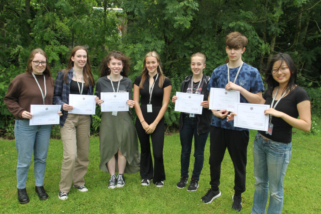 Biology Olympiad students holding their certificates